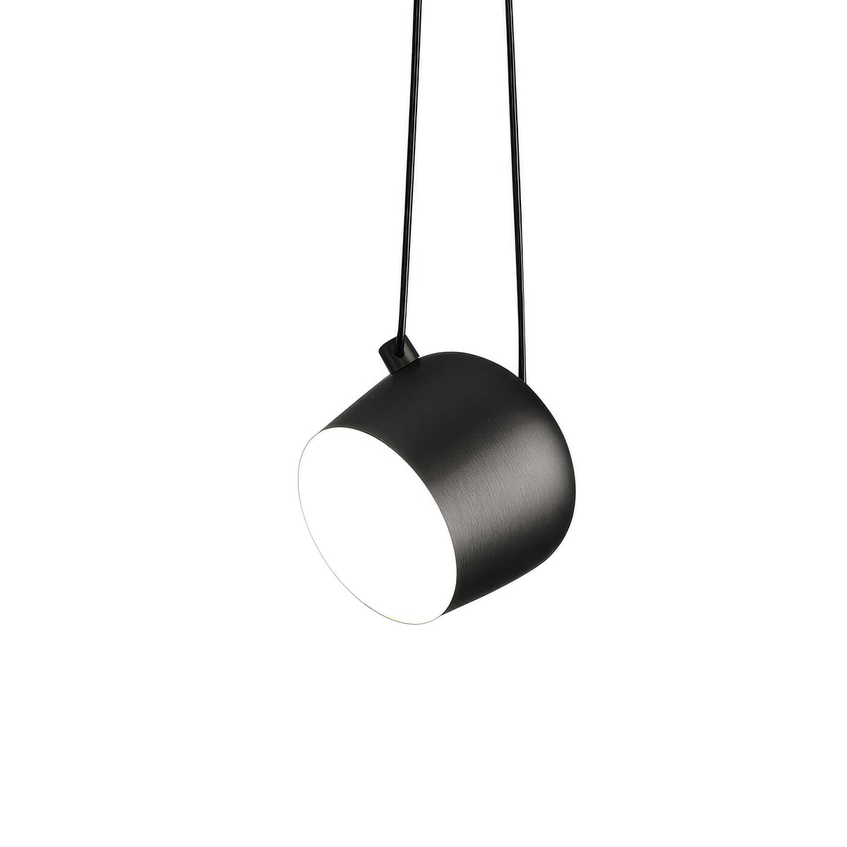 Flos Aim Suspension Lamps by Erwan & Ronan Bouroullec. A sleek black cylindrical pendant lamp hangs from thin cords.