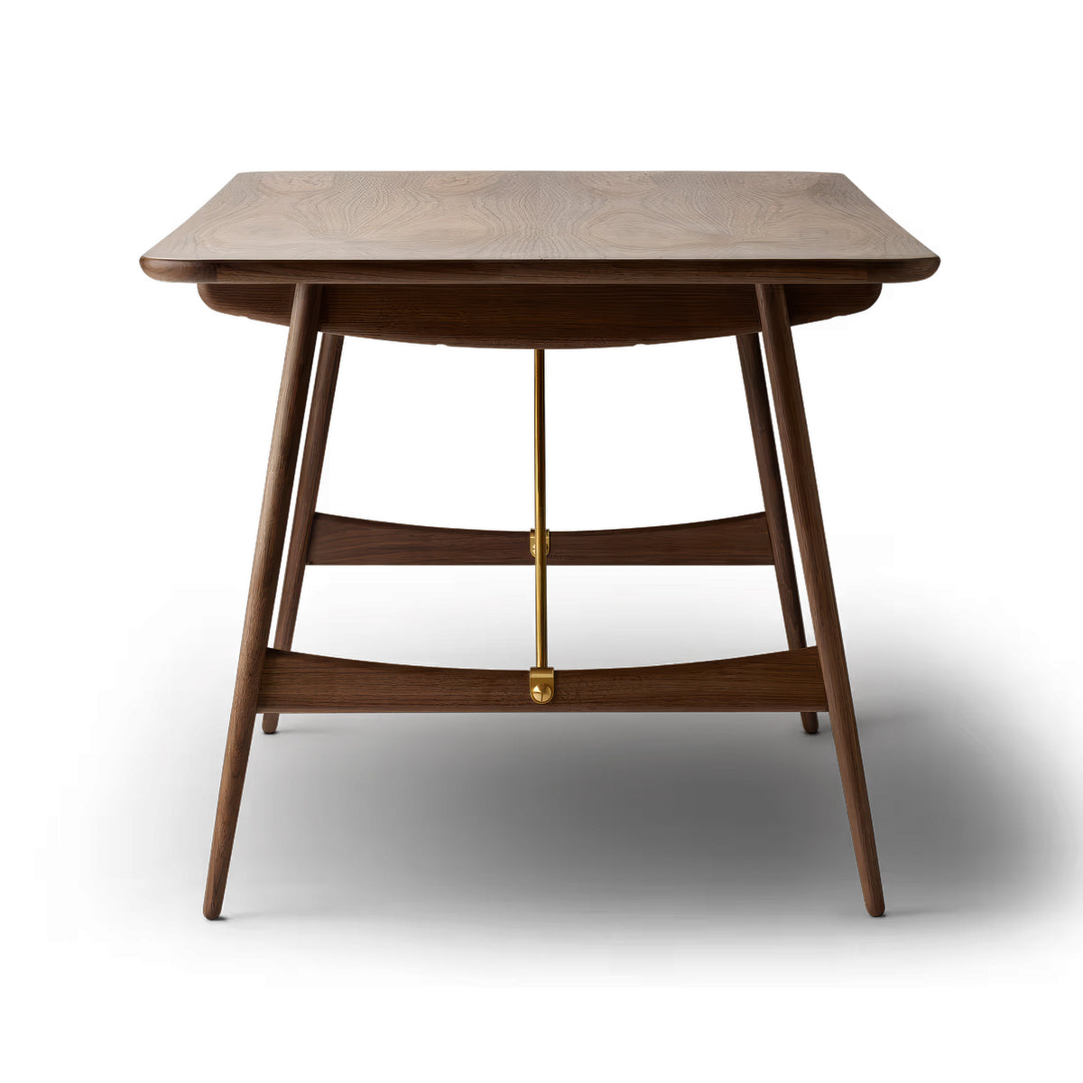 Carl Hansen & Søn BM1160 Hunting Table by Børge Mogensen. A wooden table with curved legs and brass accents.