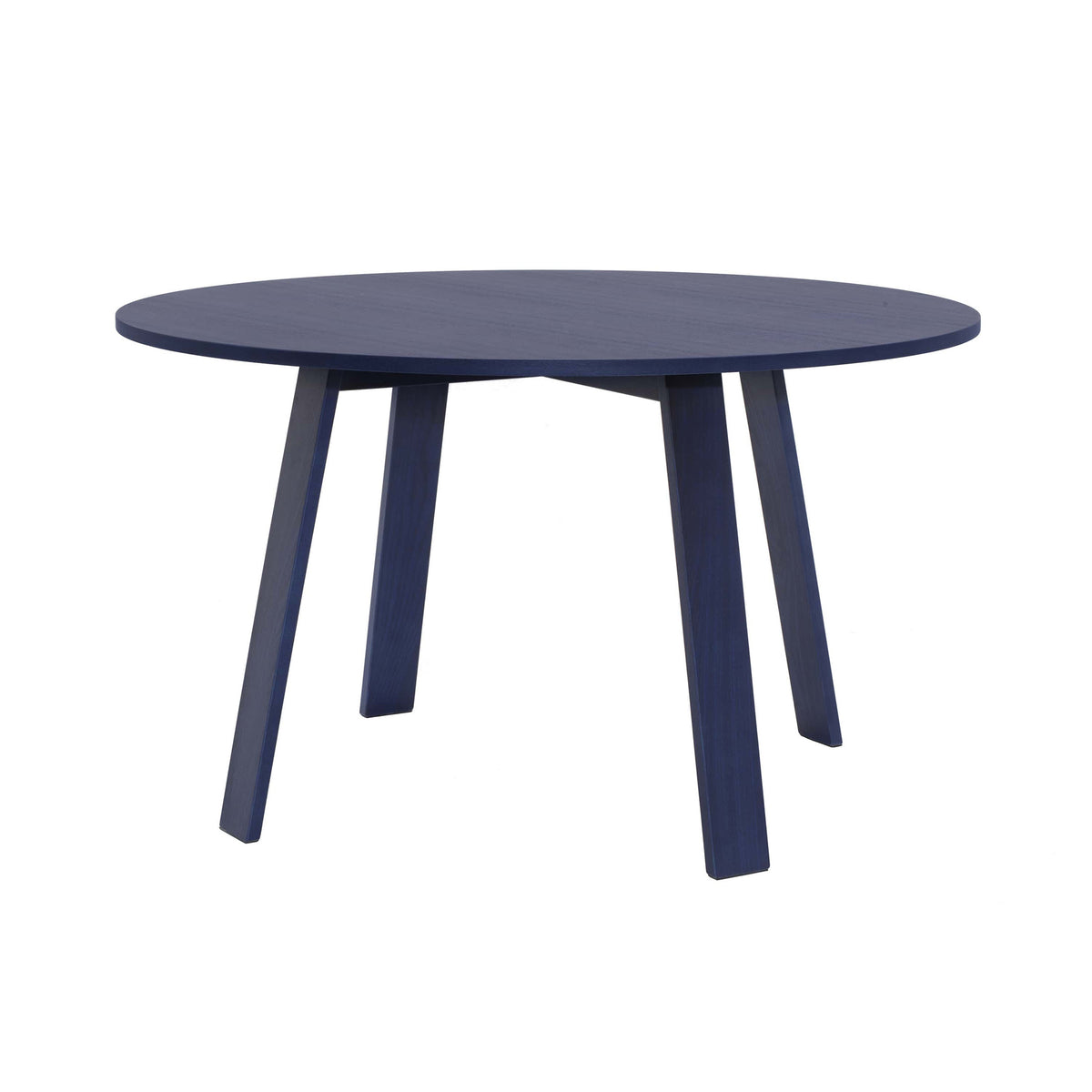 Cappellini Bac Table by Jasper Morrison. A dark blue round table with four tapered legs sits against a white background.