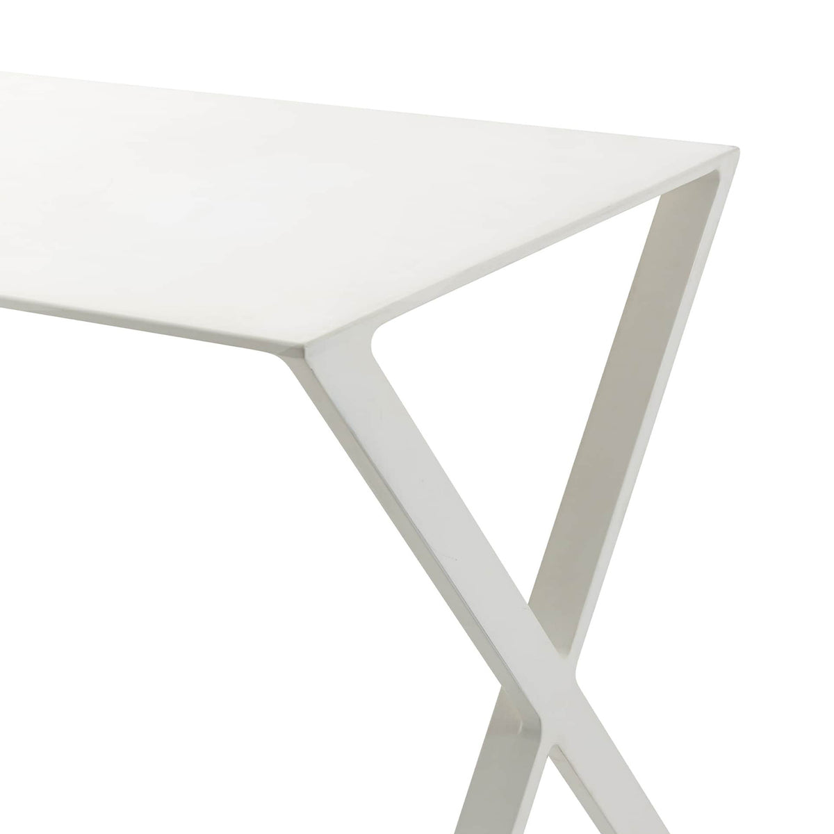 Cappellini Bambi by Nendo. A minimalist white table with a smooth matte finish and an X-shaped base design.