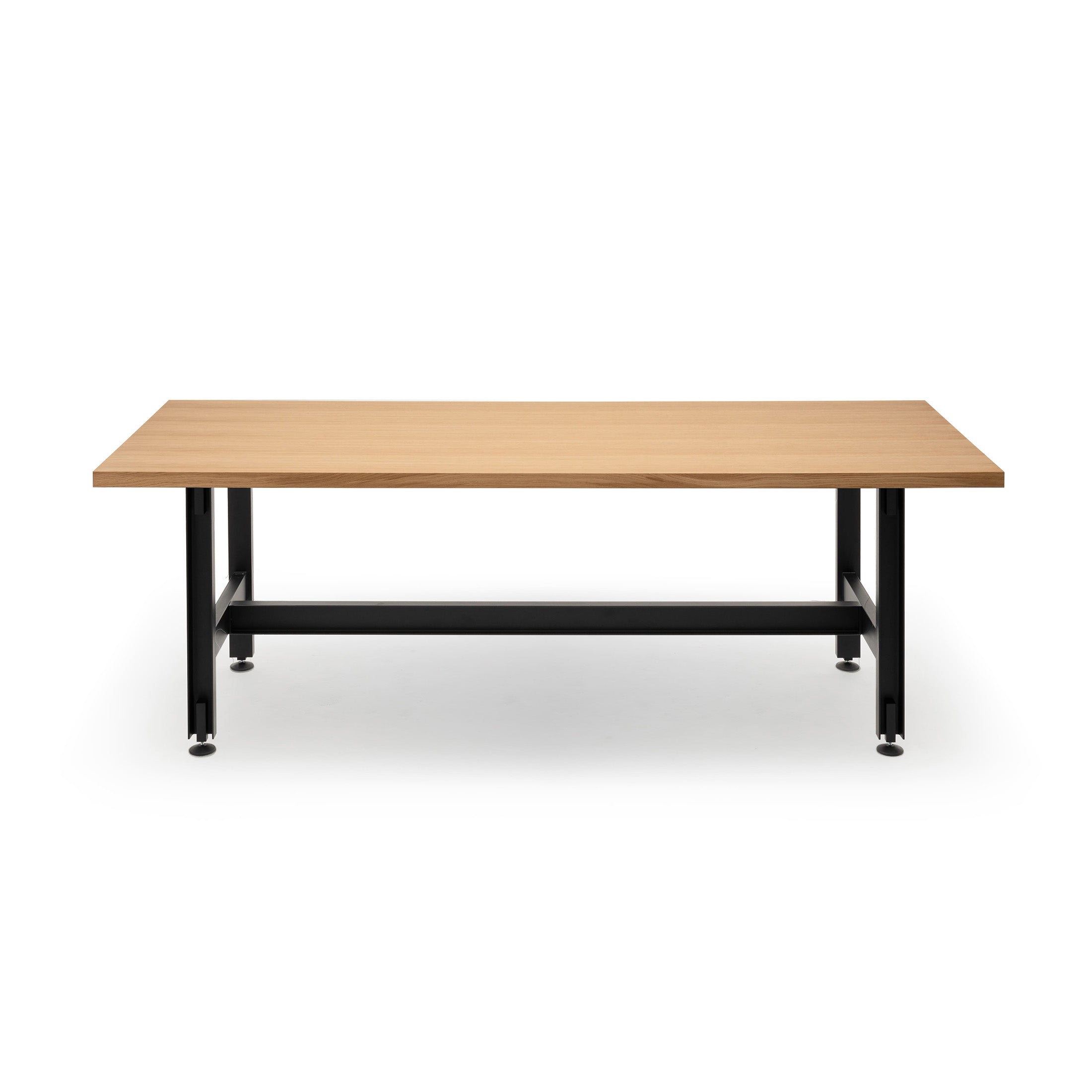 Established & Sons Beam Table by Konstantin Grcic. A wooden table with black metal legs and a connecting beam bar.
