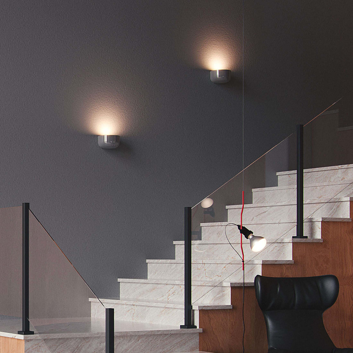 Flos Bellhop Wall Up by Edward Barber. Modern staircase with marble steps, black railings, and warm wall lighting.