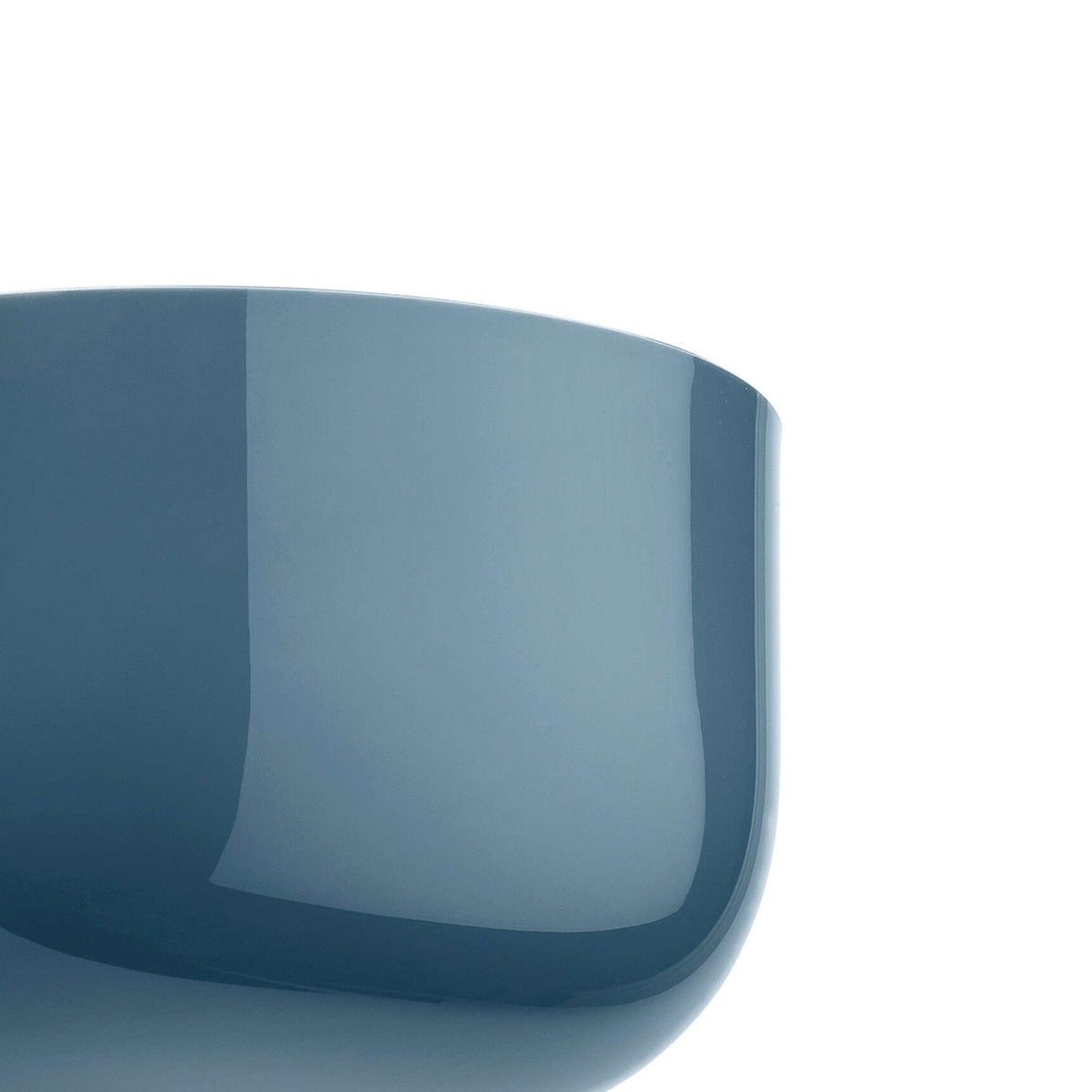 Flos Bellhop Wall Up by Edward Barber. A sleek blue curved container with a glossy finish sits against a white background.