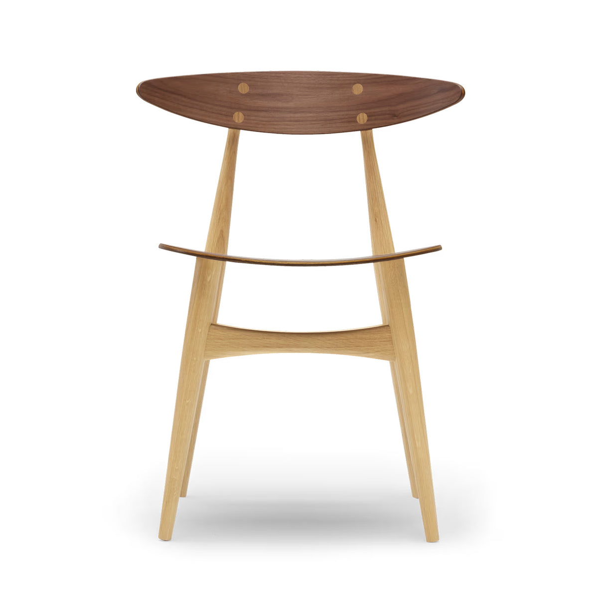 Carl Hansen & Søn CH33T Chair by Hans J. Wegner. A mid-century modern wooden stool with a walnut top and light oak legs.