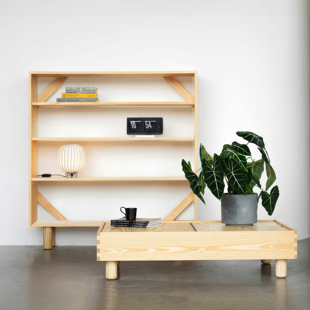 Established&Sons Crate Series by Jasper Morrison. Light wood furniture with shelves, books, a lamp, and potted plant.