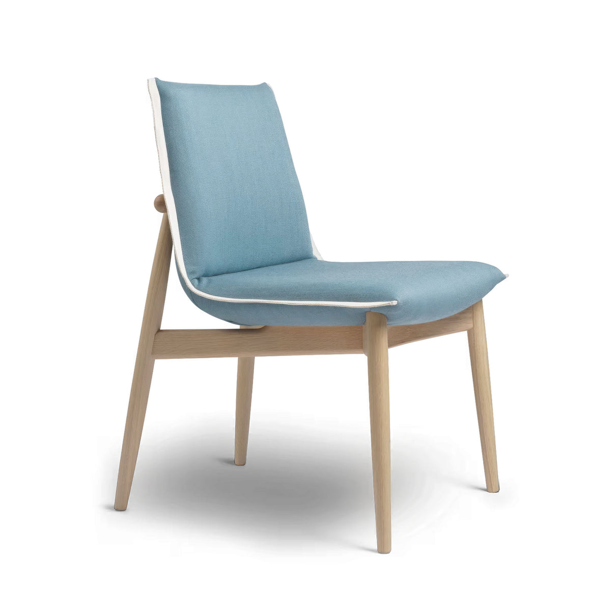 Carl Hansen & Søn E004 Embrace Chair by EOOS. A light wood chair with a curved blue upholstered seat and back.