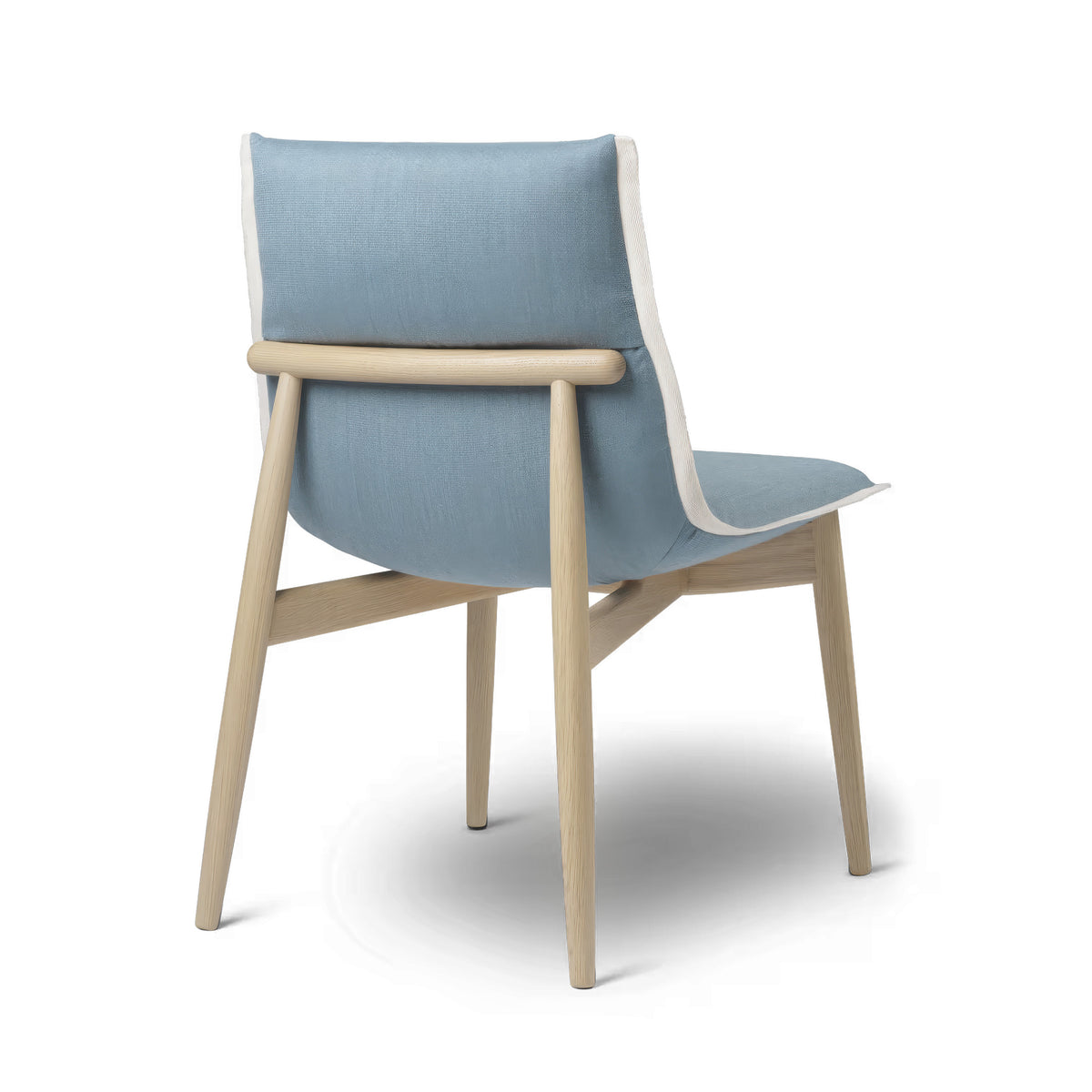 Carl Hansen & Søn E004 Embrace Chair by EOOS. A light wood chair with blue-grey upholstered seat and backrest.