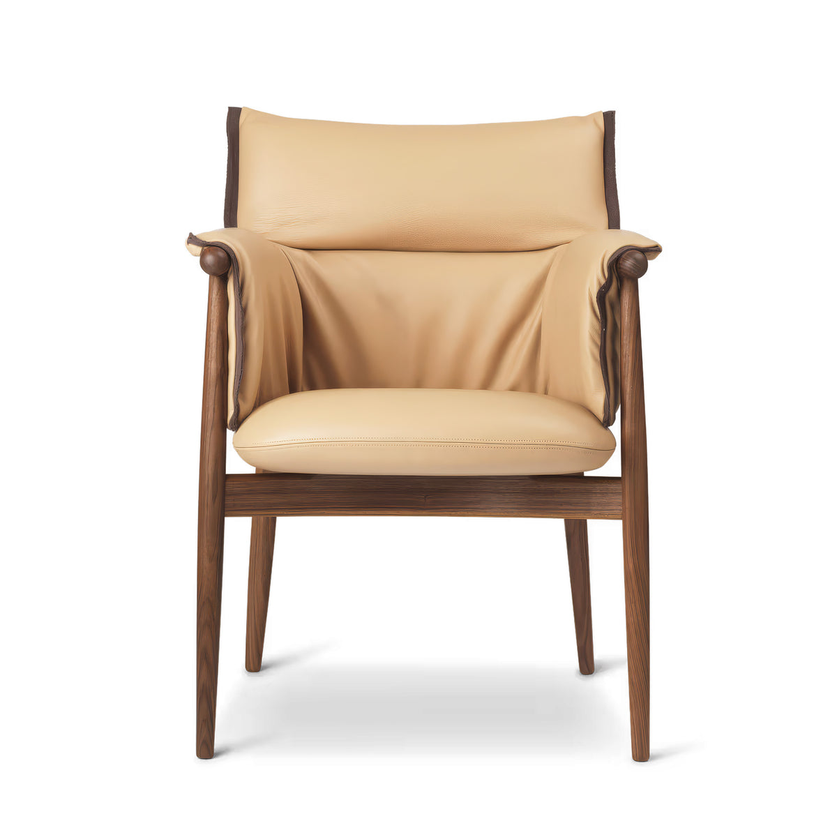 Carl Hansen & Søn E005 Embrace Armchair by EOOS. A cream leather chair with rolled wooden arms and dark wood frame.