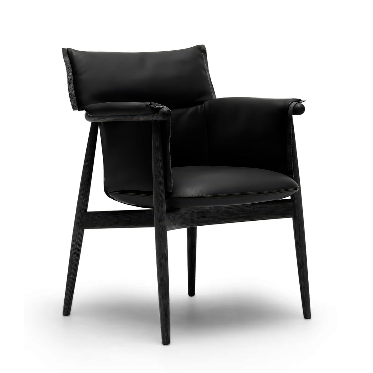 Carl Hansen & Søn E005 Embrace Armchair by EOOS. A sleek black leather chair with dark wooden frame and rolled armrests.