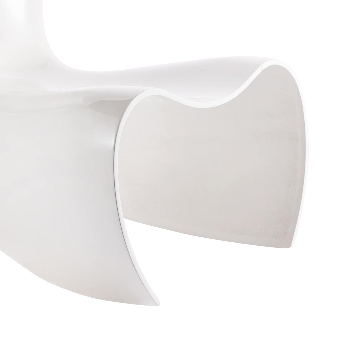 Cappellini Felt Chair by Marc Newson. A sleek white curved sculptural form sits against a soft, minimalist background.