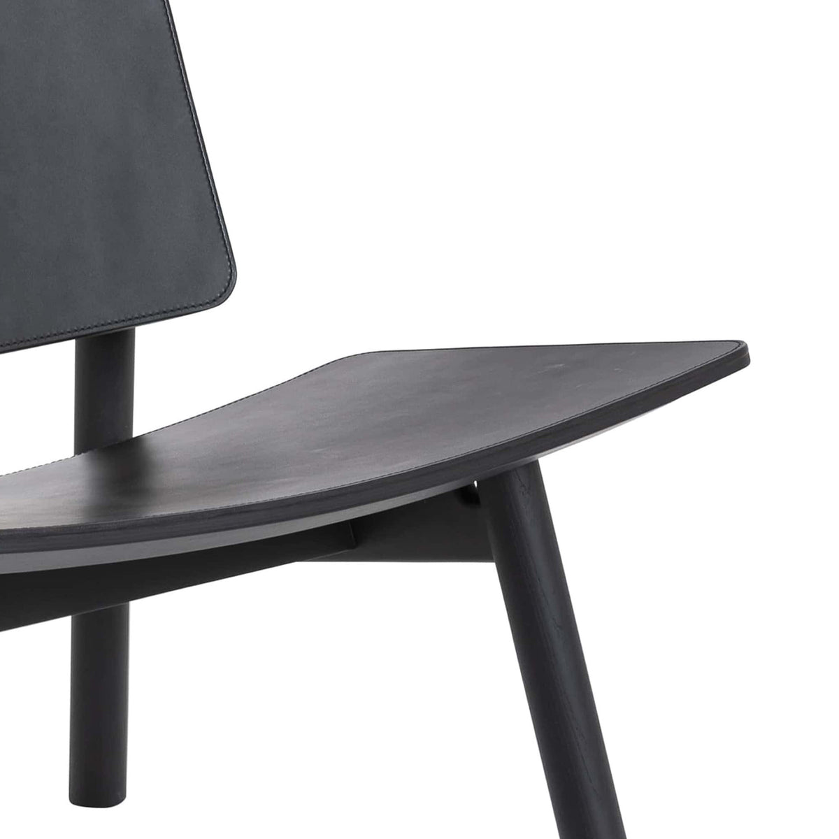 Cappellini Hiroi by Cyril Dunděra and Matěj Janský. A modern black chair with a wooden seat and padded backrest.