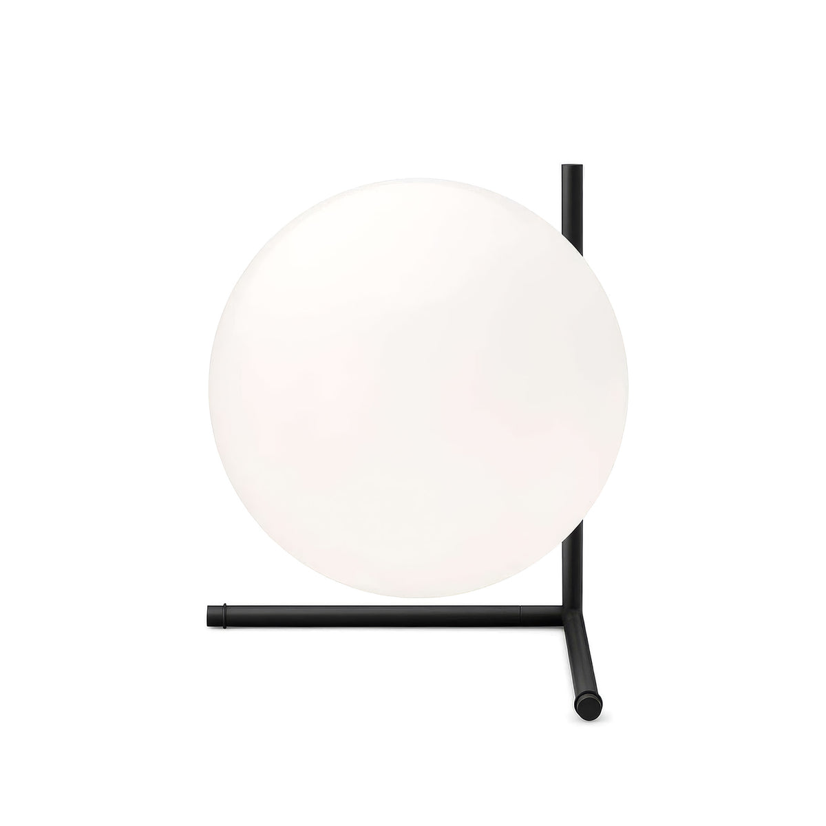 Flos IC Lights T2 by Michael Anastassiades. A frosted white sphere rests on a minimalist black metal stand.