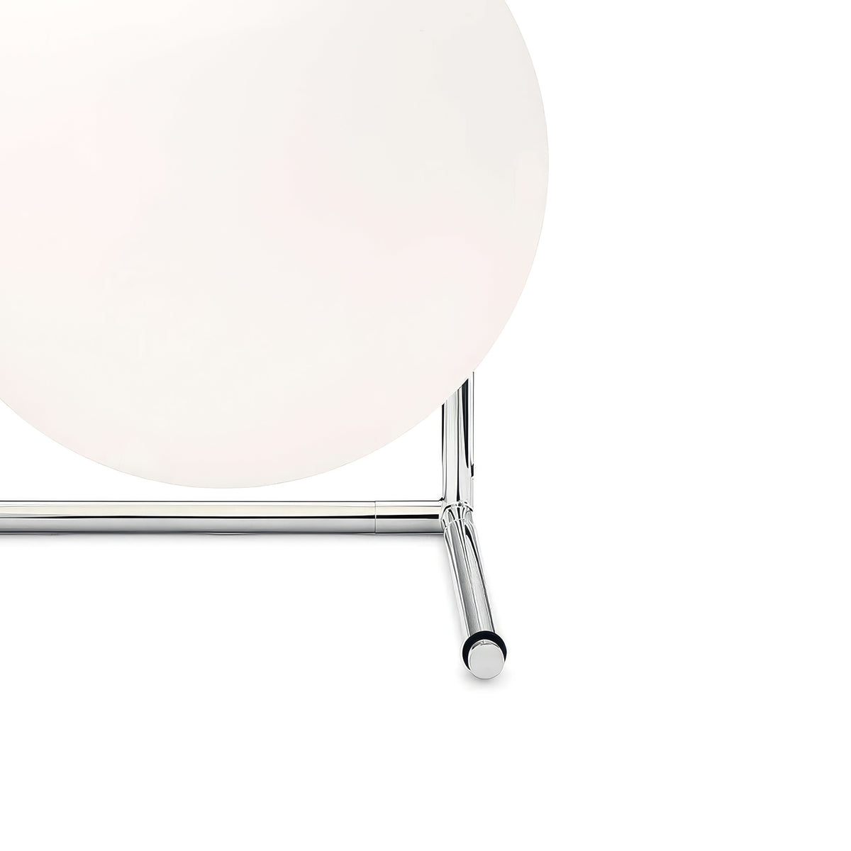 Flos IC Lights T2 by Michael Anastassiades. A sleek chrome rod supports a frosted white spherical shade.