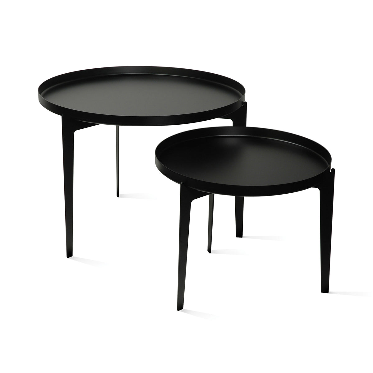 COVO Illusion - Two in One by Minna Niskakangas. Two black round tables with sleek metal frames and matte surfaces.