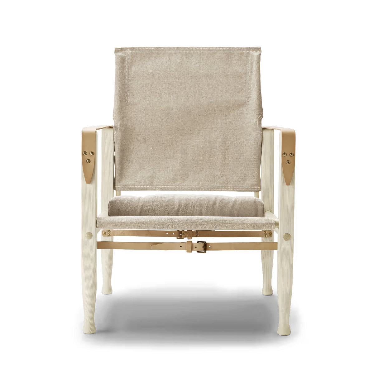 Carl Hansen & Søn KK47000 Safari Chair by Kaare Klint. A cream canvas chair with wooden frame and leather straps.