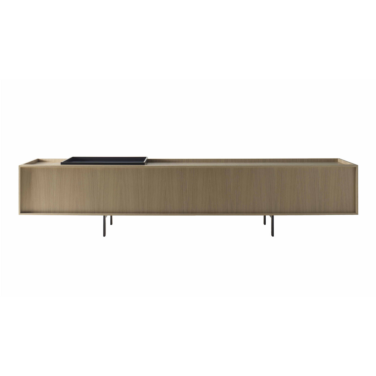 Cappellini Lochness Cabinet by Piero Lissoni. A light wood credenza with metal legs holds a black tray on top.