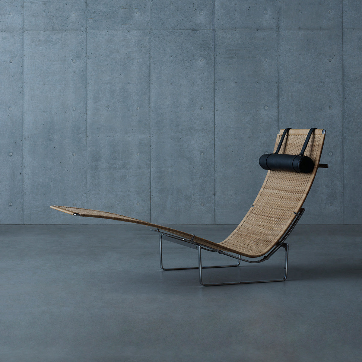 Mobile / PK24 Lounge Chair, designed by Poul Kjærholm and made by Fritz Hansen