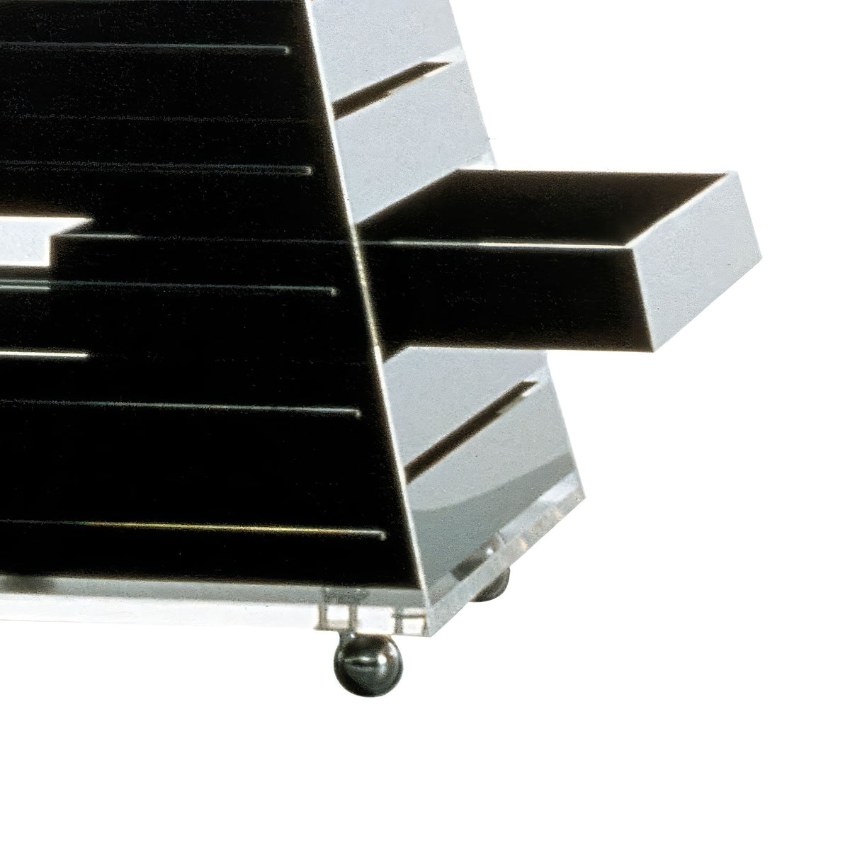 Cappellini Pyramid by Shiro Kuramata. Black and white geometric storage boxes with sleek modern design and metallic base.