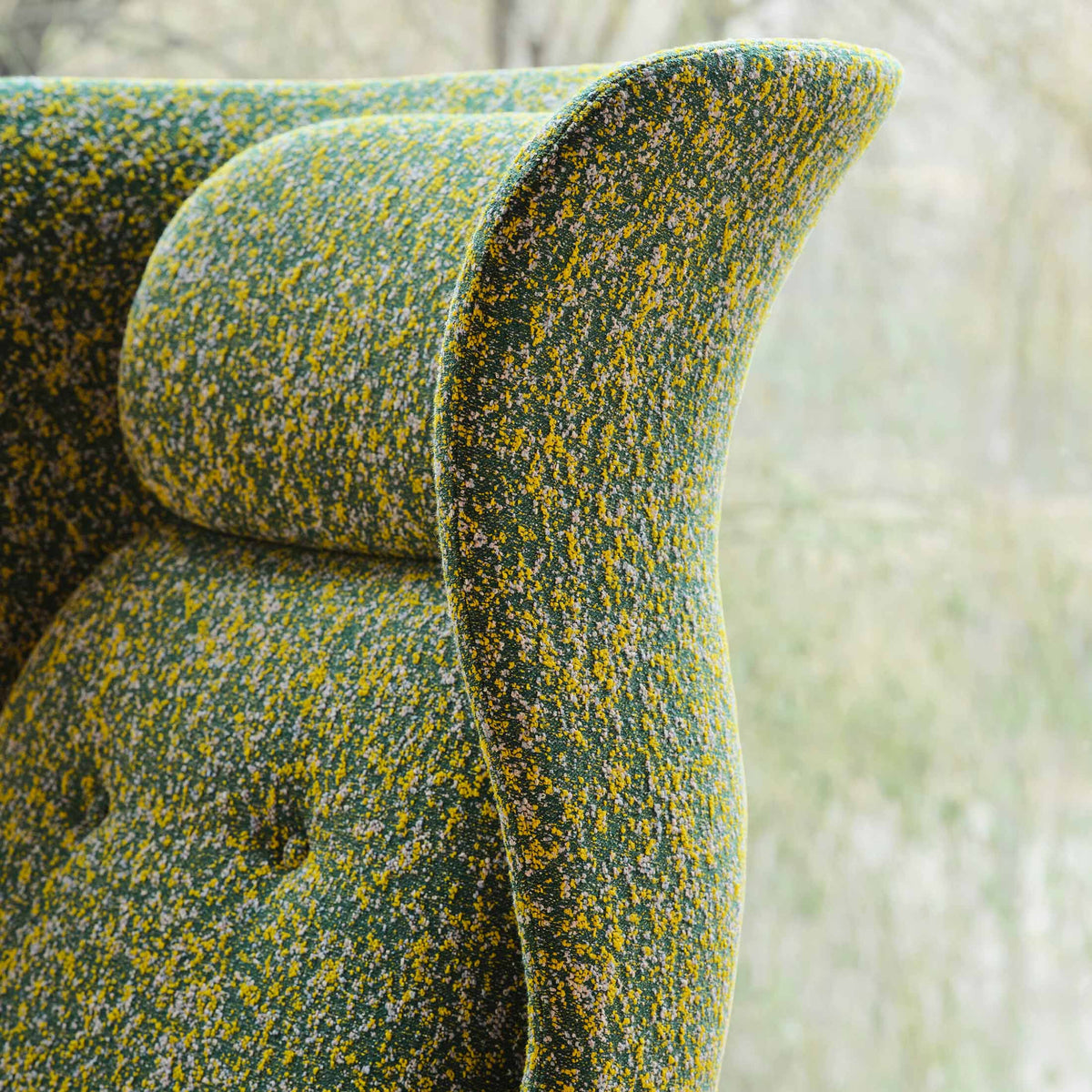 Fritz Hansen Ro™ JH1 Mixed Upholstery by Jaime Hayon. Textured yellow and blue upholstered armrest detail.