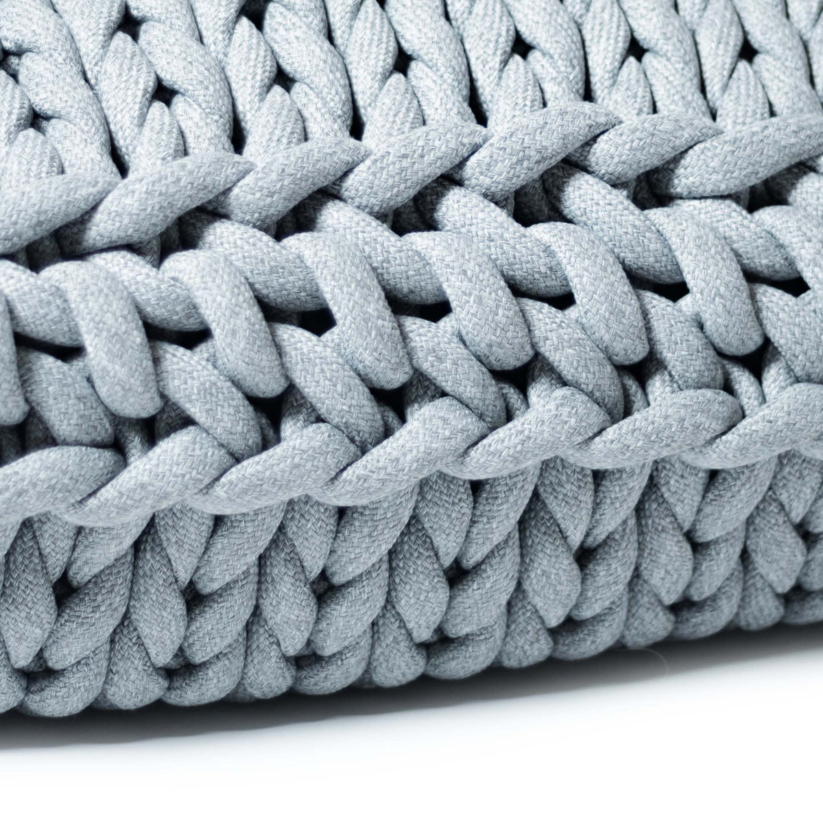 COVO Roxy Maxi Cushion by Rosanna Contadini. Thick gray twisted rope coils densely together in soft, uniform bundles.