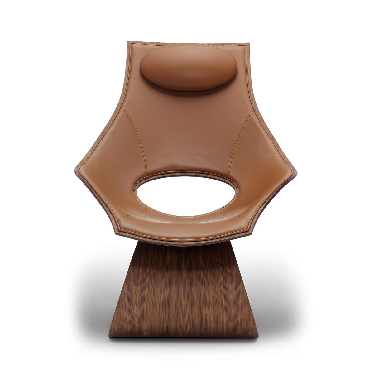 Carl Hansen & Søn TA001P Dream Chair by Tadao Ando. A tan leather chair with a wooden base sits against a white background.