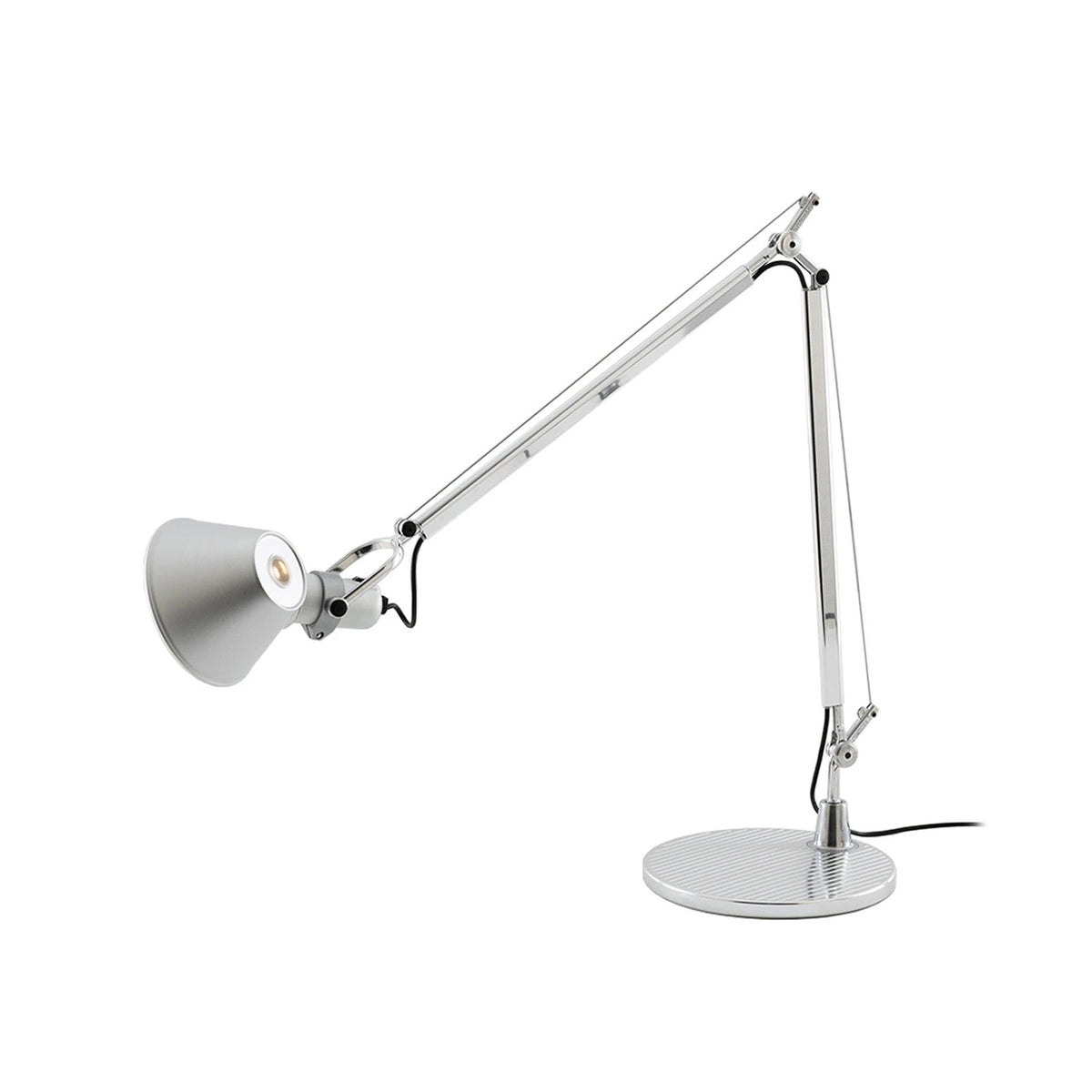 Artemide Tolomeo Table by Michele De Lucchi. A silver articulating desk lamp with a conical shade and weighted base.