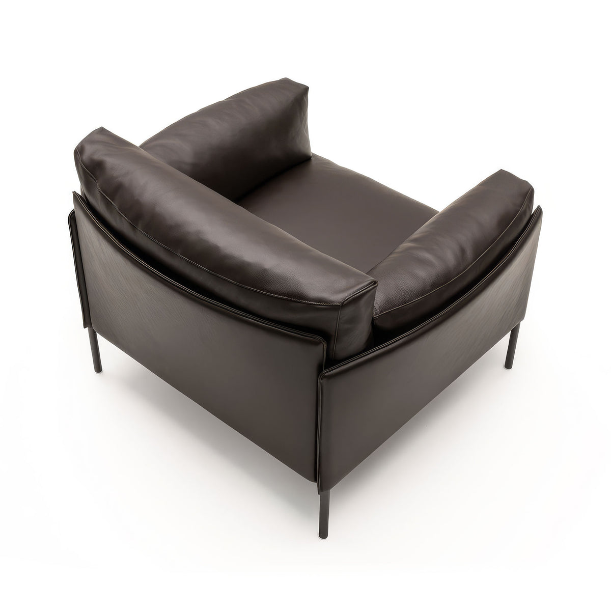 Living Divani Greene Armchair by David Lopez Quincoces. Dark leather armchair with metal legs on white.