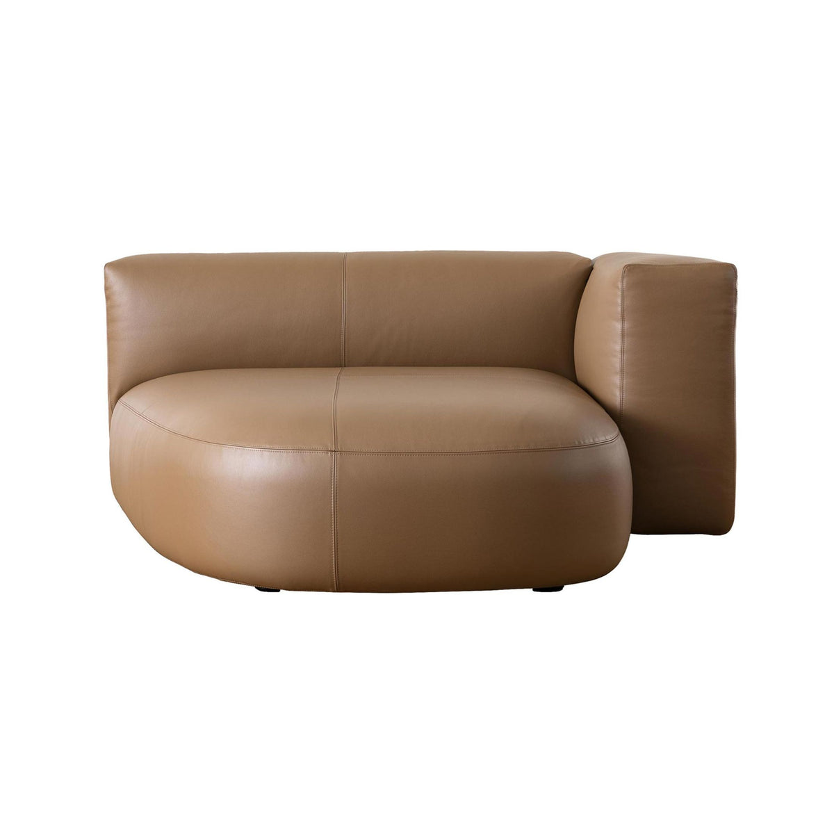 Cappellini Litos by Sebastian Herkner. A curved tan leather armchair with rounded forms sits against a white background.