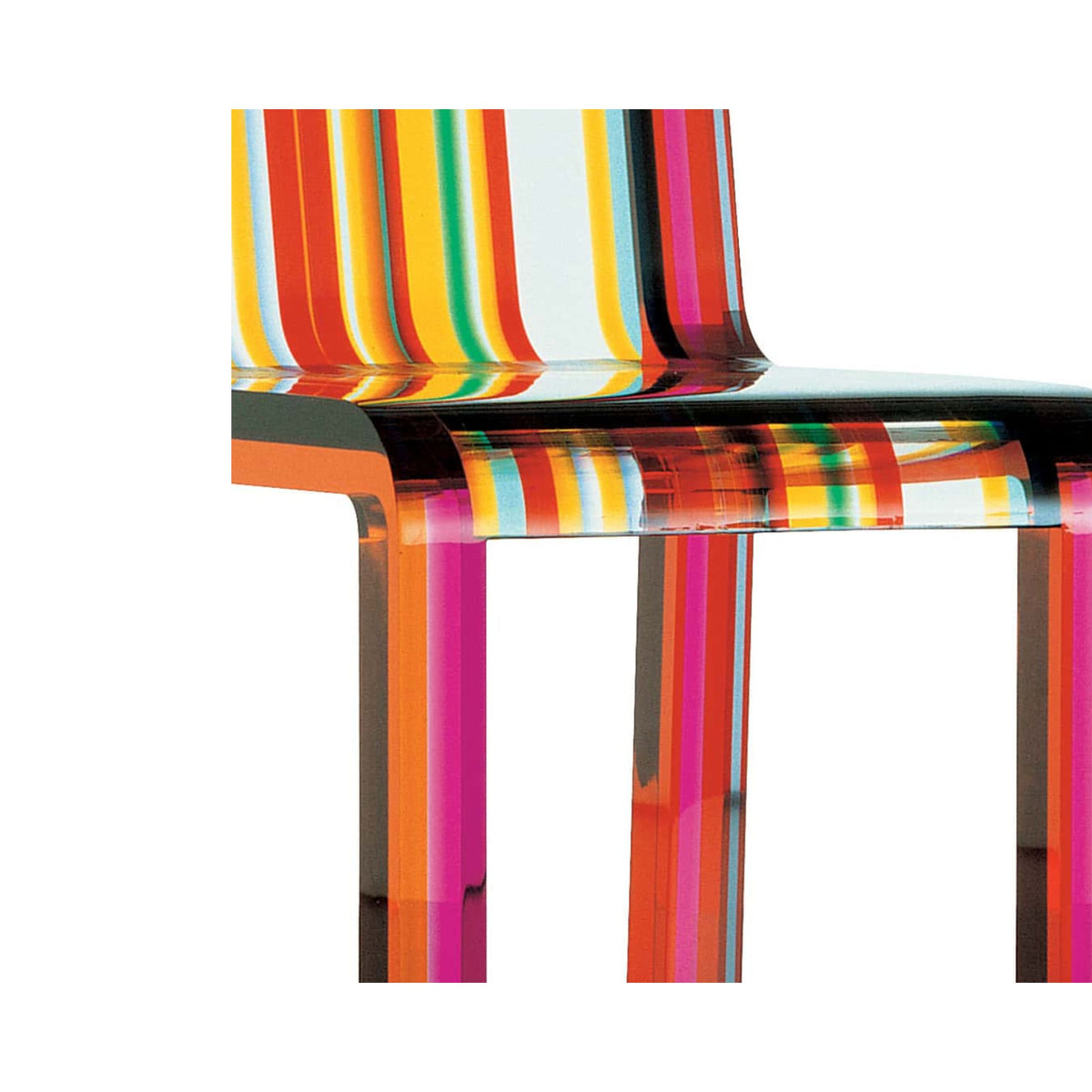 Cappellini Rainbow Chair by Patrick Norguet. A vibrant chair features bold rainbow stripes in red, yellow, orange, and pink.
