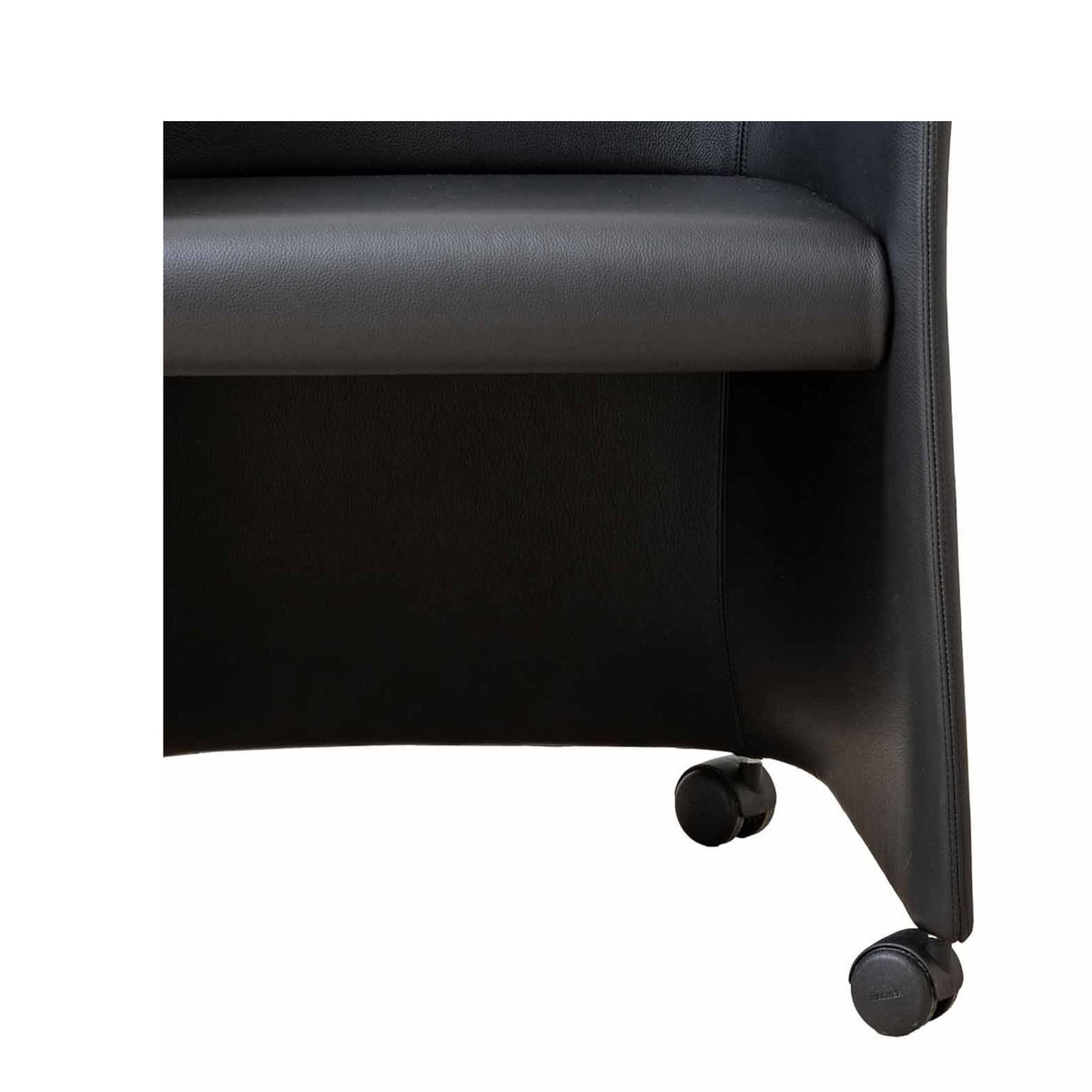 Cappellini San Siro by Jasper Morrison. Black leather chair with padded armrest and rolling casters.