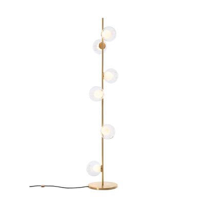 Bocci 28.6 Stem Floor by Omer Arbel. A brass floor lamp with five frosted glass globe shades emits warm light.
