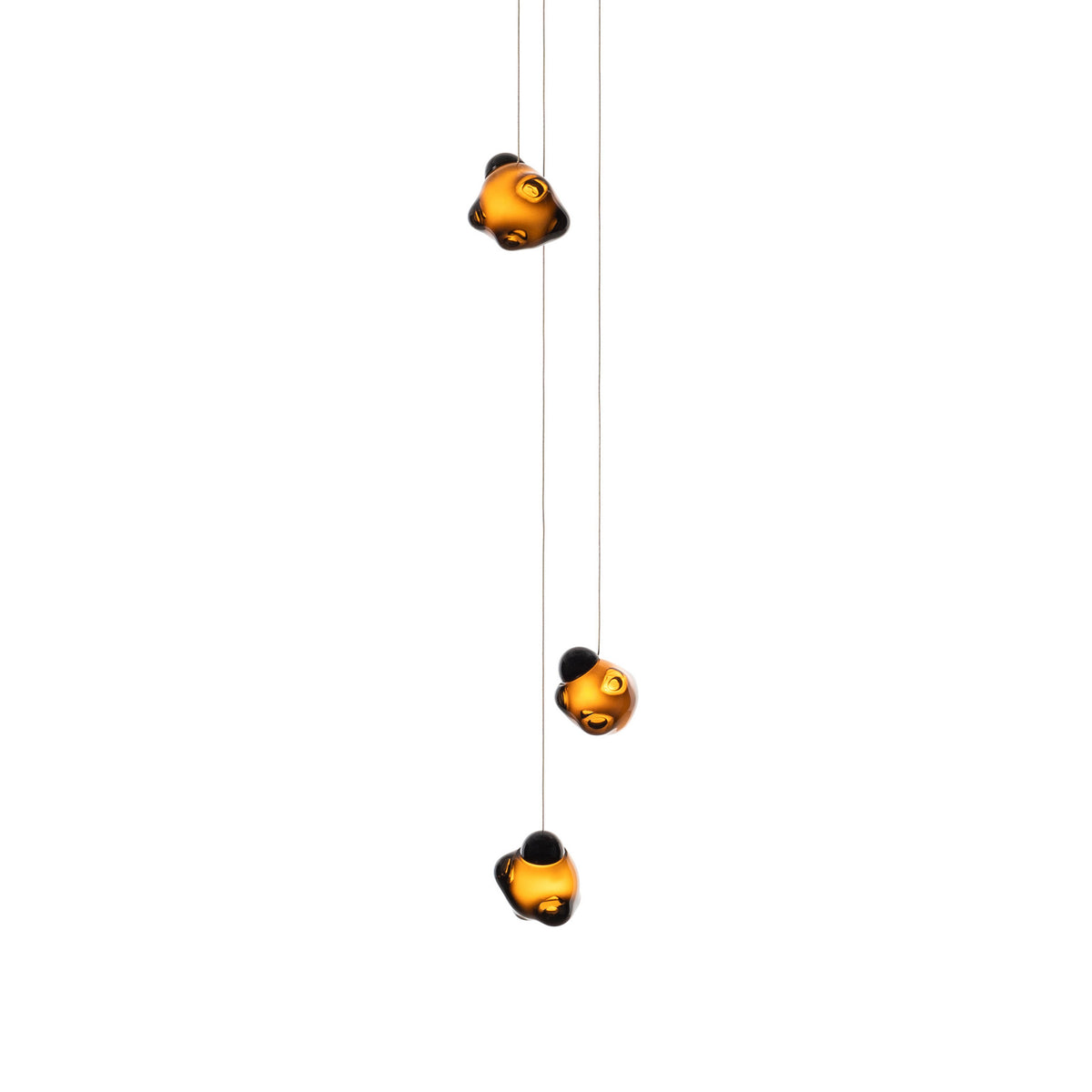 Bocci 57.3 Random by Omer Arbel. Three golden glass spheres with black caps hang from thin wires.