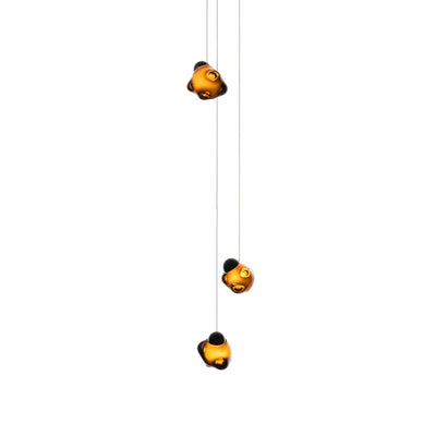 Bocci 57.3 Random by Omer Arbel. Three golden glass spheres with black caps hang from thin wires.
