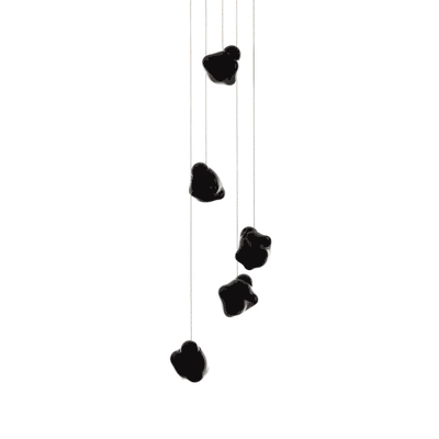 Bocci 57.5 Random by Omer Arbel. Five black stones hang from thin strings against a white background.