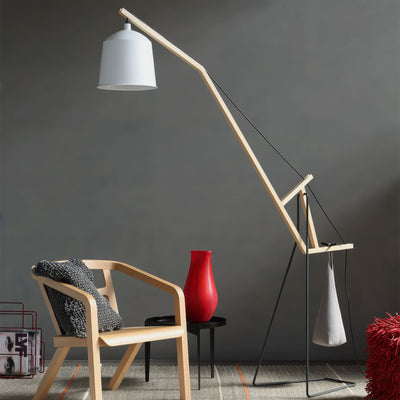 COVO A Floor Lamp by Aust & Amelung. A wooden arc lamp with white shade illuminates a modern seating area.