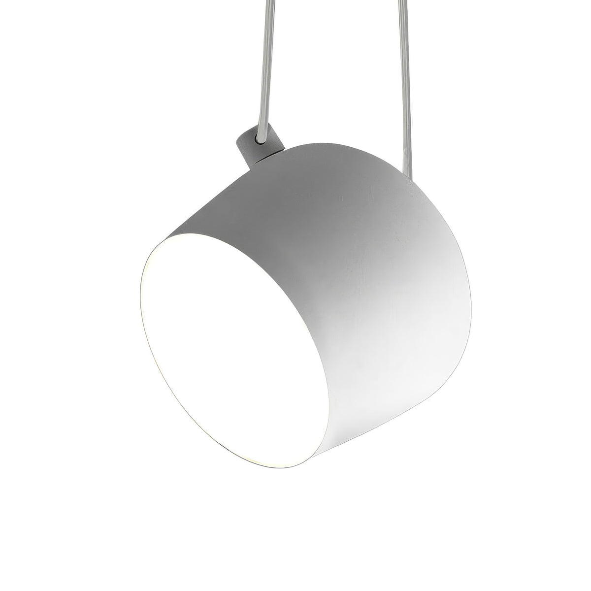 Flos Aim Suspension Lamps by Erwan & Ronan Bouroullec. A sleek gray pendant lamp hangs from wires above.