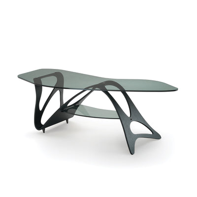 Zanotta Arabesco CM by Carlo Mollino. A sculptural black wood base supports two curved glass shelves in a modern design.