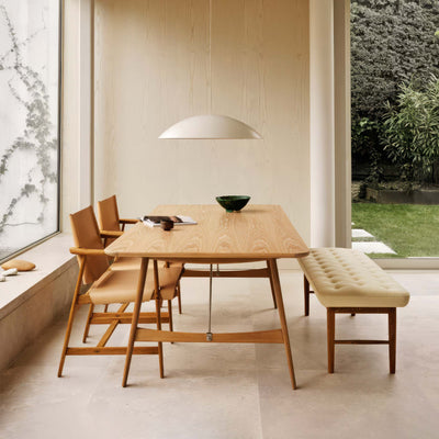 Carl Hansen & Søn BM1160 Hunting Table by Børge Mogensen. Wooden dining set in a minimalist room with natural light.