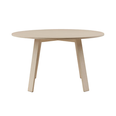 Cappellini Bac Table by Jasper Morrison. A light wood round table with four tapered legs in a minimalist style.
