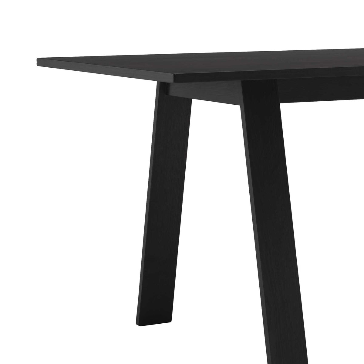 Cappellini Bac Table by Jasper Morrison. A sleek black wooden table with angled legs and a minimalist modern design.