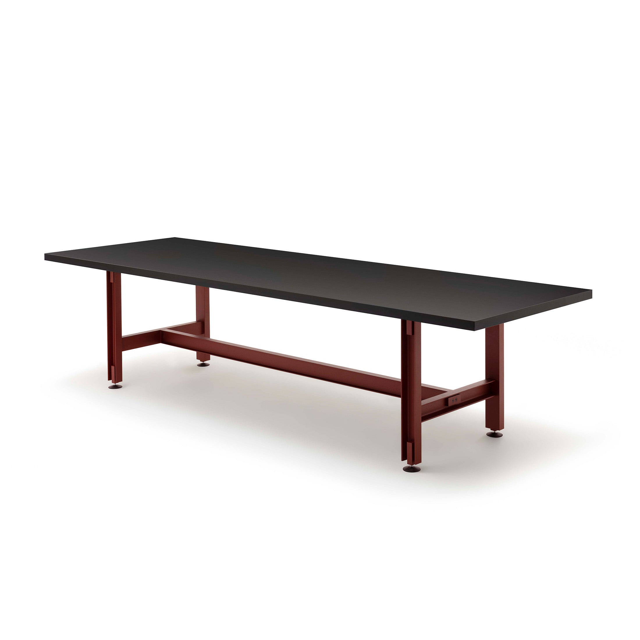 Established & Sons Beam Table by Konstantin Grcic. A black tabletop rests on a burgundy metal frame base.