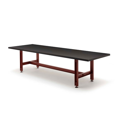 Established & Sons Beam Table by Konstantin Grcic. A black tabletop rests on a burgundy metal frame base.