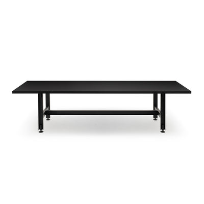 Established & Sons Beam Table by Konstantin Grcic. A sleek black table with metal legs and a lower shelf.