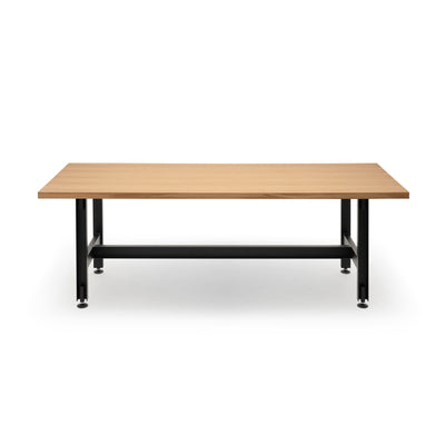 Established & Sons Beam Table by Konstantin Grcic. A wooden table with black metal legs and a connecting beam bar.