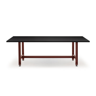Established & Sons Beam Table by Konstantin Grcic. A black-topped table with dark red metal legs and crossbrace.
