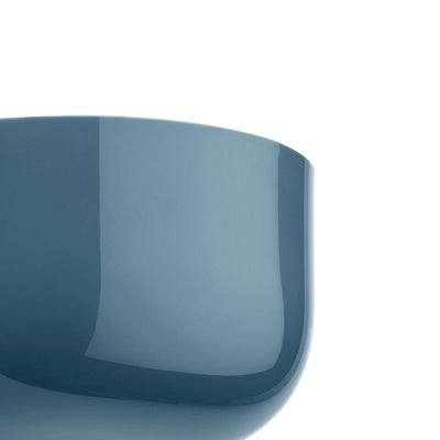 Flos Bellhop Wall Up by Edward Barber. A sleek blue curved container with a glossy finish sits against a white background.