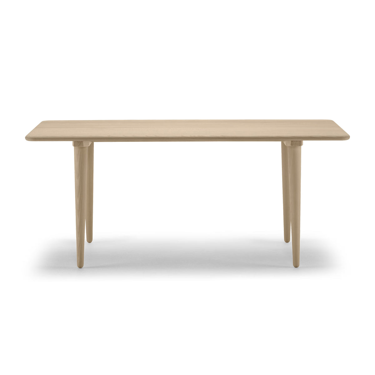 Carl Hansen & Søn CH011 Coffee Table by Hans J. Wegner. A light wood table with tapered legs in a minimalist style.