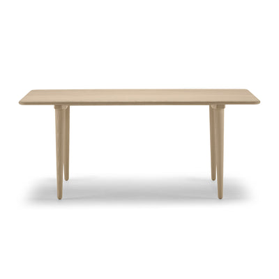 Carl Hansen & Søn CH011 Coffee Table by Hans J. Wegner. A light wood table with tapered legs in a minimalist style.