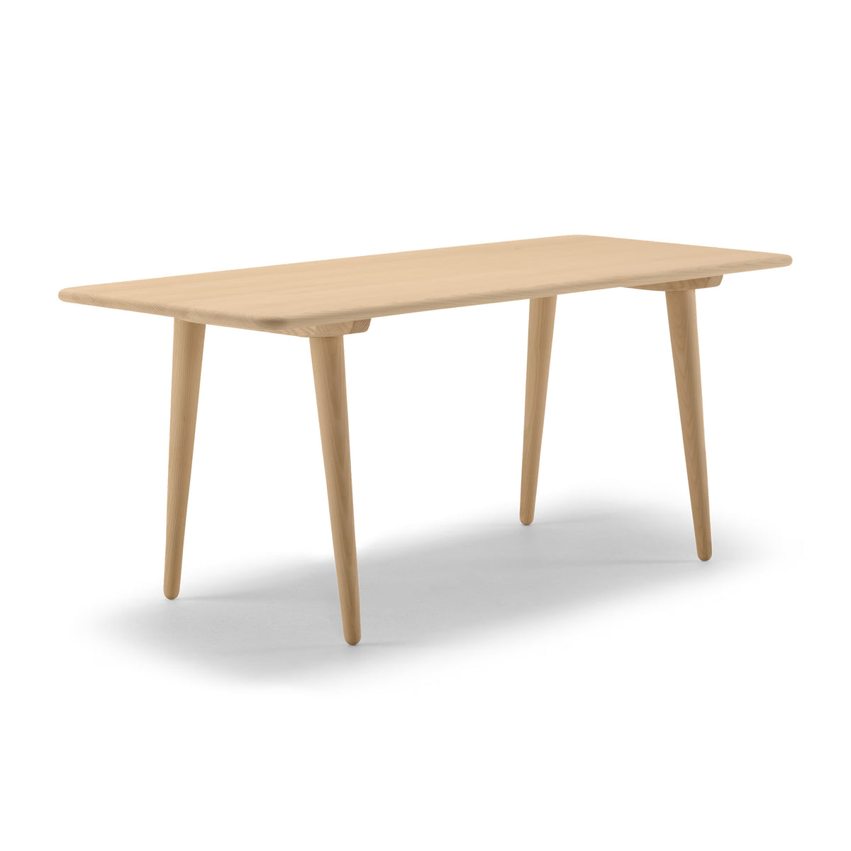Carl Hansen & Søn CH011 Coffee Table by Hans J. Wegner. A light wood table with tapered legs and rounded edges.