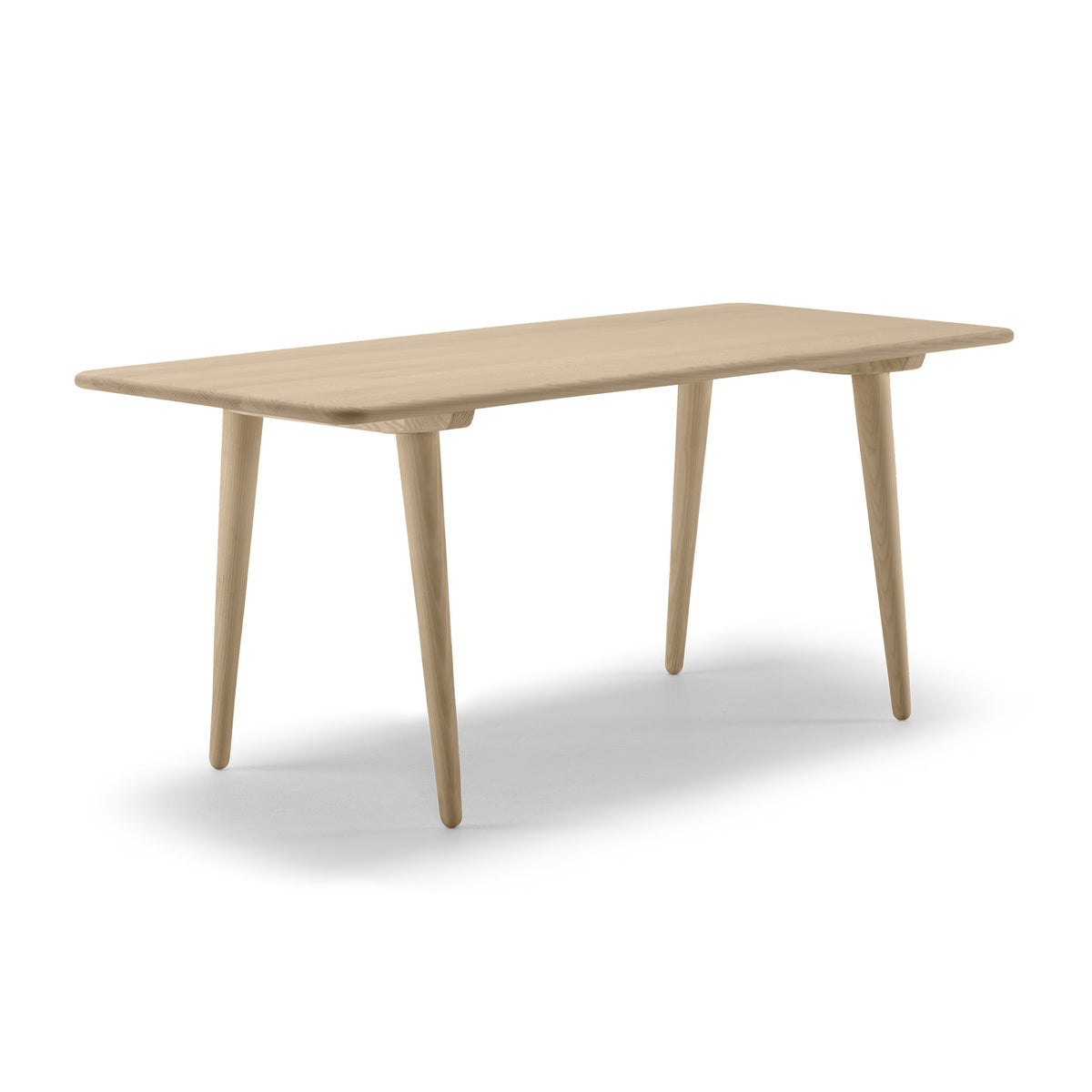 Carl Hansen & Søn CH011 Coffee Table by Hans J. Wegner. A light wood table with tapered legs and rounded edges.